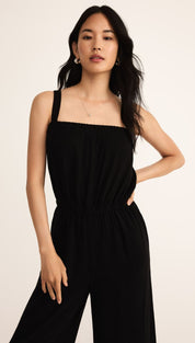 Women’s black sleeveless wide-leg jumpsuit with a smocked bodice.