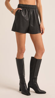Black leather knee-high boots with a chunky heel and elastic side gusset.