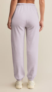 Light purple athletic joggers with elastic cuffs and waistband.