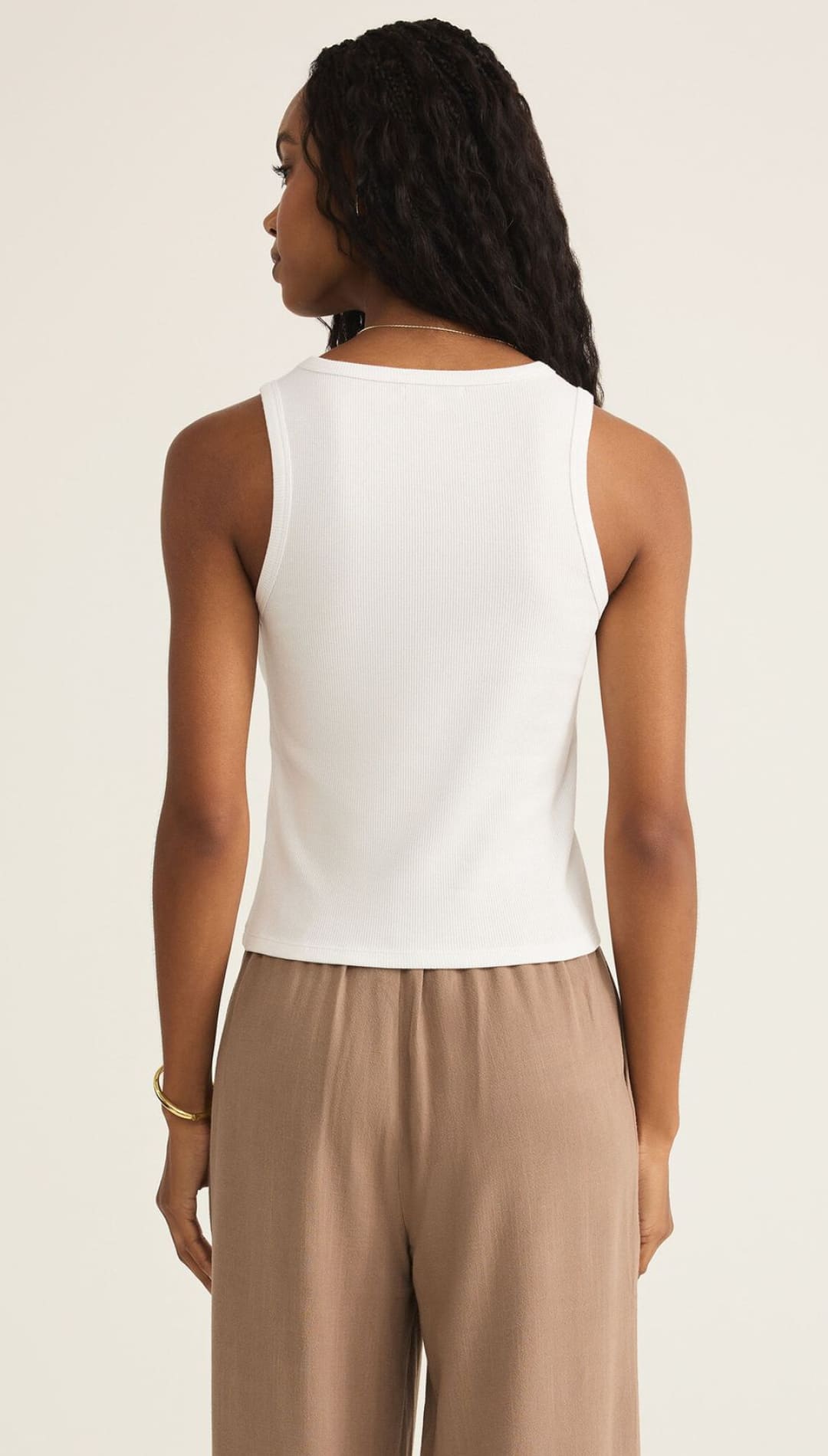 A white ribbed tank top with a high neckline.