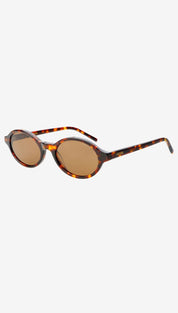 Tortoiseshell-patterned round sunglasses with brown lenses and a sleek, minimalist design.